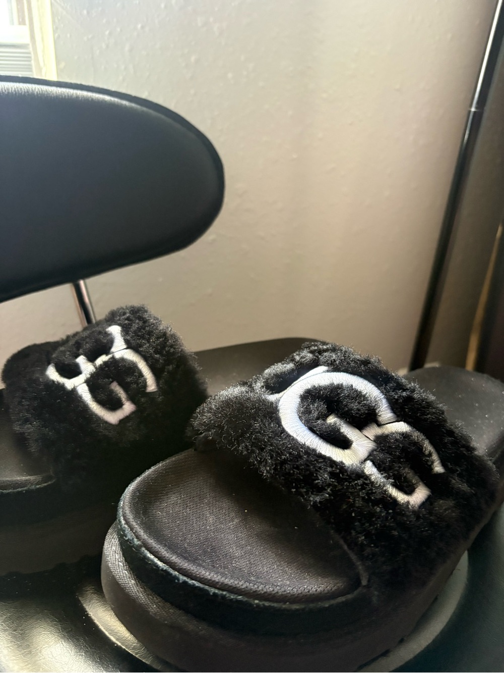 UGG Black Faux-Fur Slide Sandals with White Logo